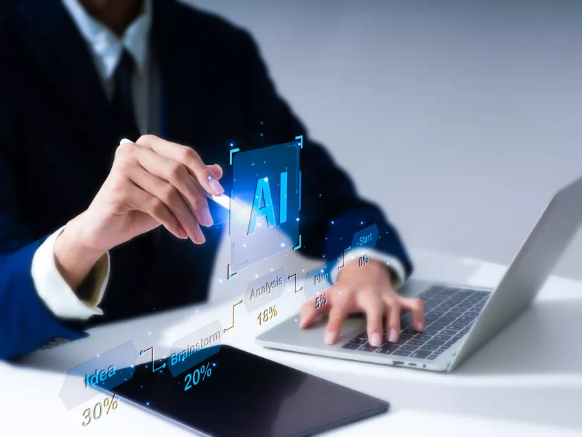 Photo of hands and a laptop