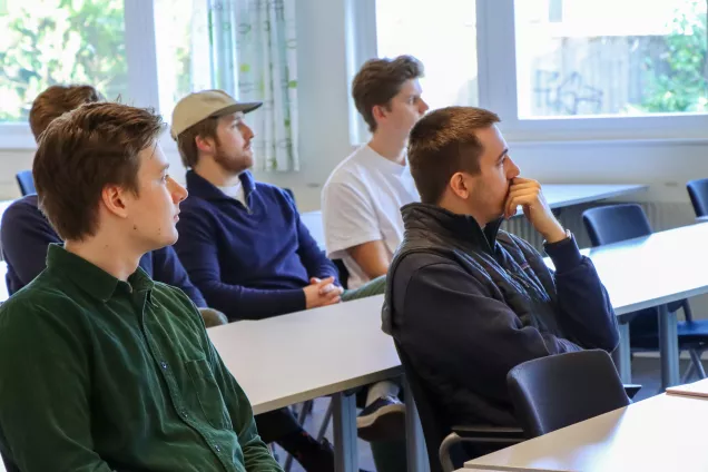 Students listening to lectures at desks